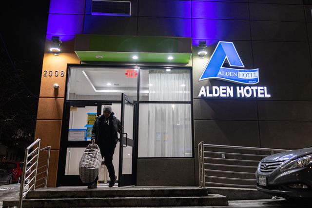 A former Twin Parks tenant leaving the Alden Hotel on Webster Avenue
